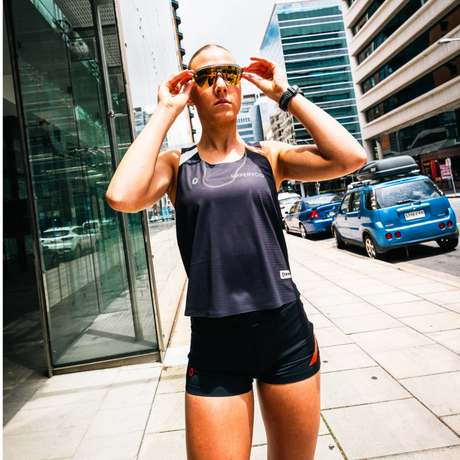 One Running - One Running Women's Victory Speed Tech Singlet OR X Uppervoid - 24k - Cam2 